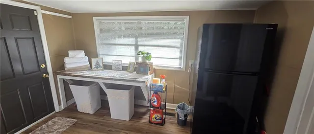 a kitchen with a refrigerator and washer