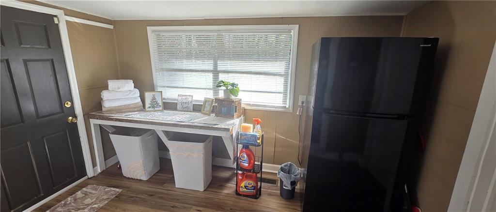 7043 South Goddard Road Stonecrest, GA 30038 - Photo 24 of 33 a kitchen with a refrigerator and washer