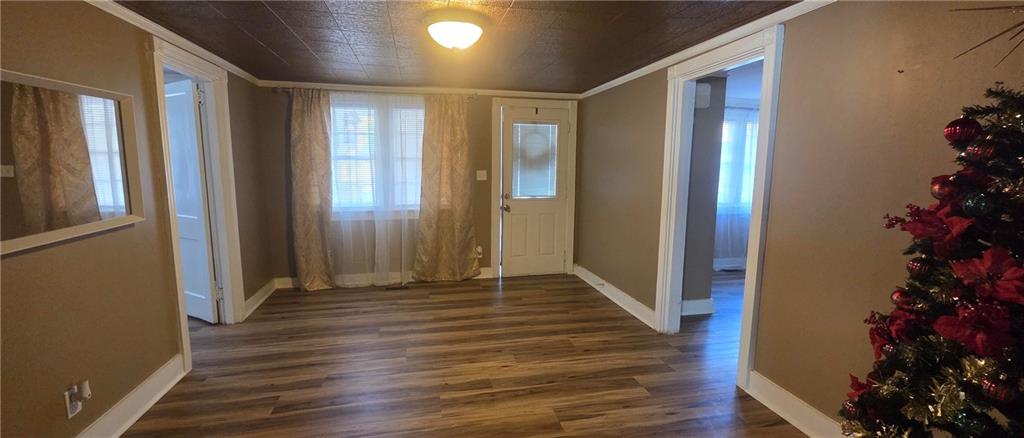 7043 South Goddard Road Stonecrest, GA 30038 - Photo 9 of 33 a view of a hallway with wooden floor and flower pot
