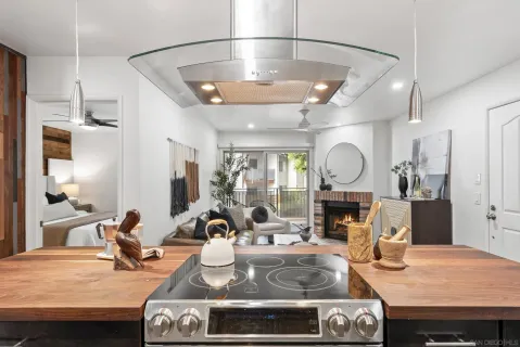 a kitchen with a table chairs stove and refrigerator