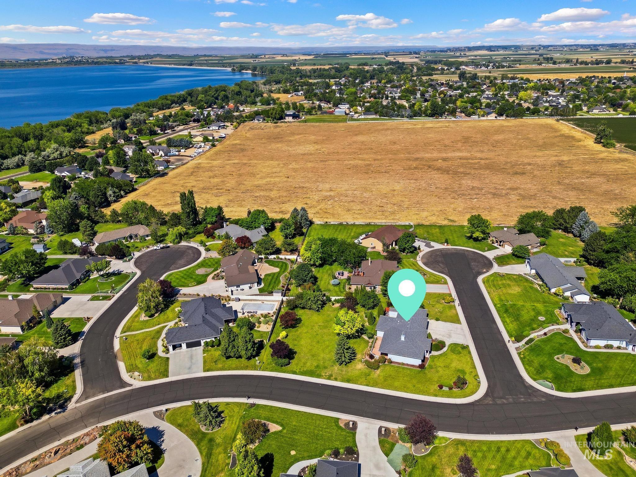 15181 Drury Way Caldwell, ID 83607 - Photo 47 of 49 Aerial perspective showcasing a residential neighborhood with landscaped properties and mature trees
