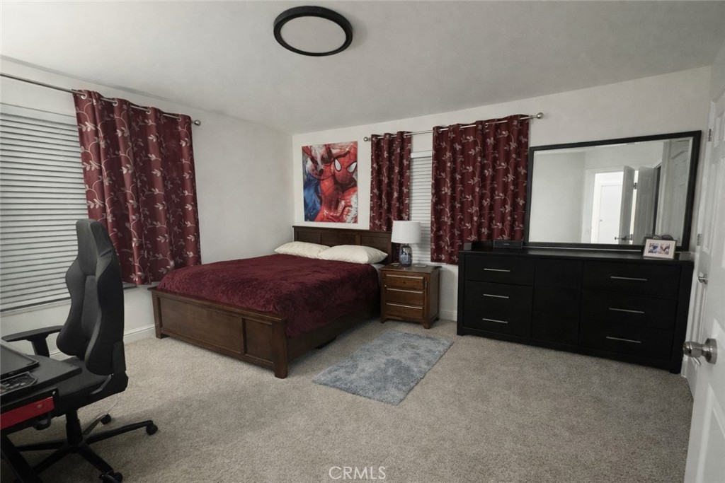 14464 Dove Canyon Drive Riverside, CA 92503 - Photo 15 of 25 a bedroom with a bed and a dresser