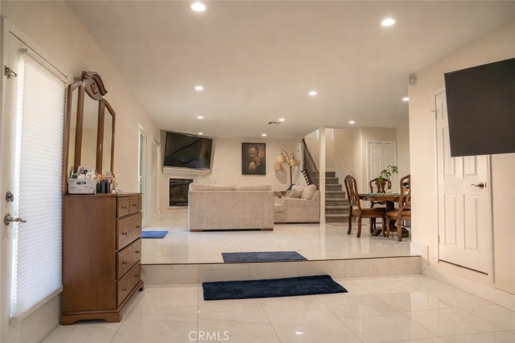 14464 Dove Canyon Drive Riverside, CA 92503 - Photo 18 of 25 a living room with stainless steel appliances furniture a rug and a flat screen tv