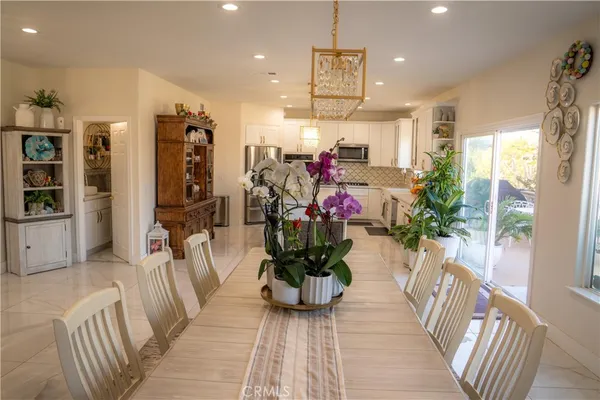 a hallway with wooden table and chairs