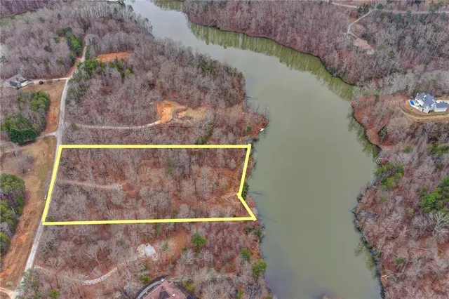 a view of a lake with a yard