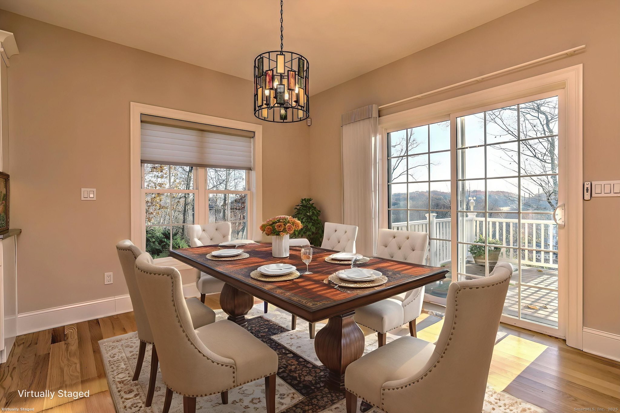 126 Wells View Road, Unit 126 Shelton, CT 06484 - Photo 14 of 26 a view of a dining room with furniture wooden floor and a chandelier
