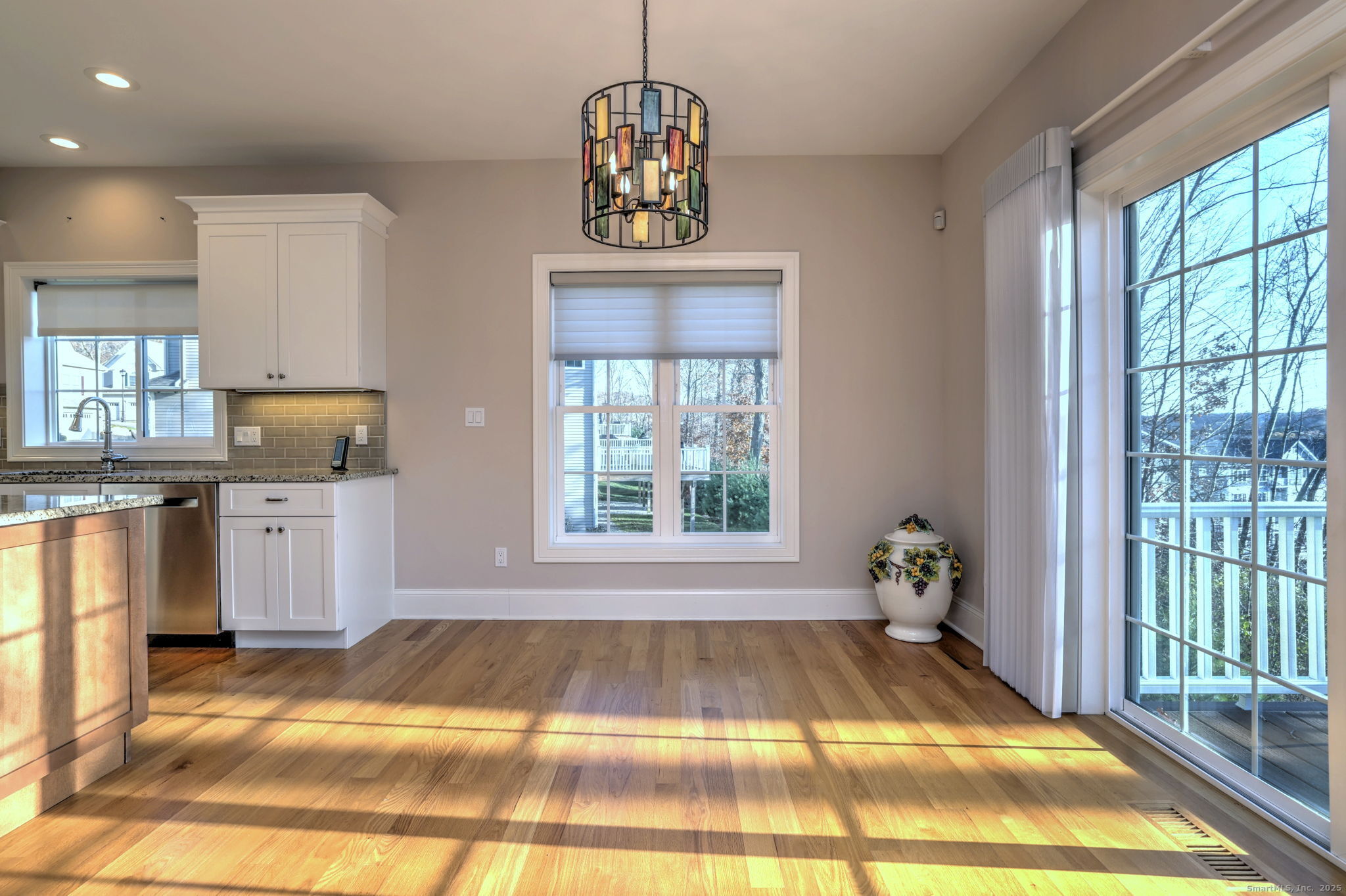 126 Wells View Road, Unit 126 Shelton, CT 06484 - Photo 15 of 26 a view of a room with kitchen island and windows