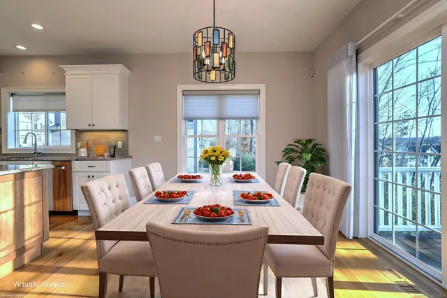 a view of a dining room with furniture window and outside view
