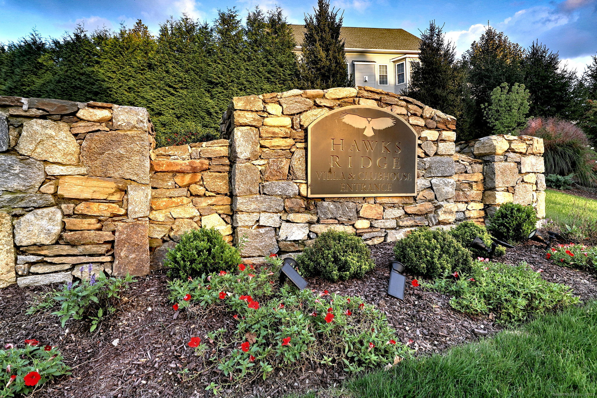 126 Wells View Road, Unit 126 Shelton, CT 06484 - Photo 2 of 26 a view of a white house with a yard and garden