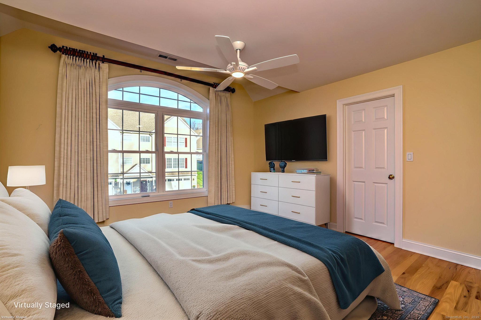 126 Wells View Road, Unit 126 Shelton, CT 06484 - Photo 22 of 26 a bedroom with a bed tv and a window