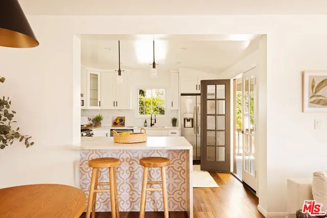 a view of kitchen with furniture and wooden floor