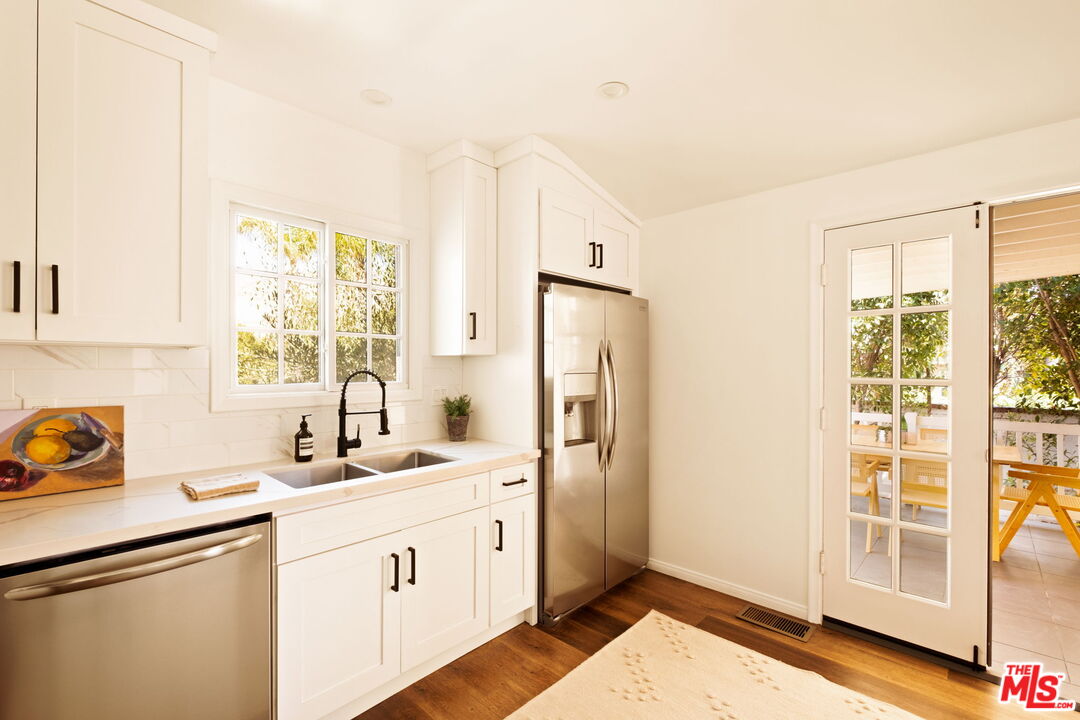 1275 North Craig Avenue Pasadena, CA 91104 - Photo 14 of 30 a kitchen with a sink appliances cabinets and a large window