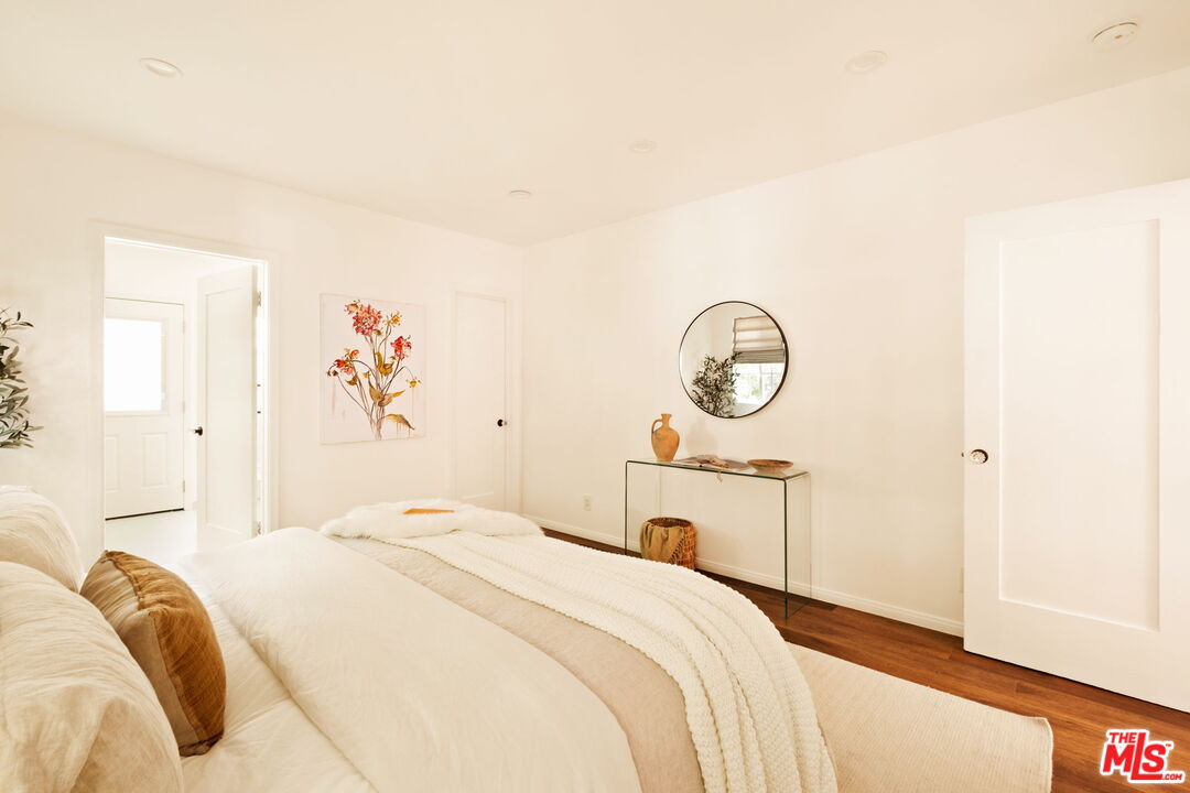 1275 North Craig Avenue Pasadena, CA 91104 - Photo 16 of 30 a bedroom with a bed and a chandelier