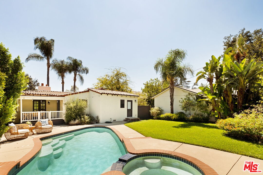 1275 North Craig Avenue Pasadena, CA 91104 - Photo 2 of 30 a swimming pool with outdoor seating and yard