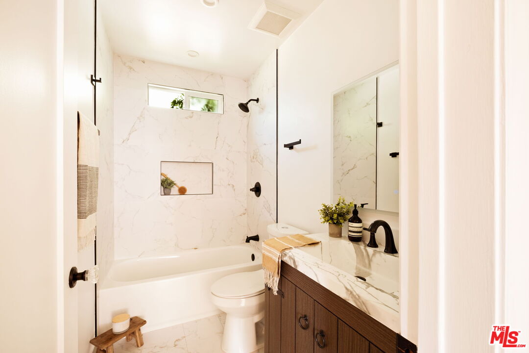 1275 North Craig Avenue Pasadena, CA 91104 - Photo 22 of 30 a bathroom with a sink a toilet and a bathtub