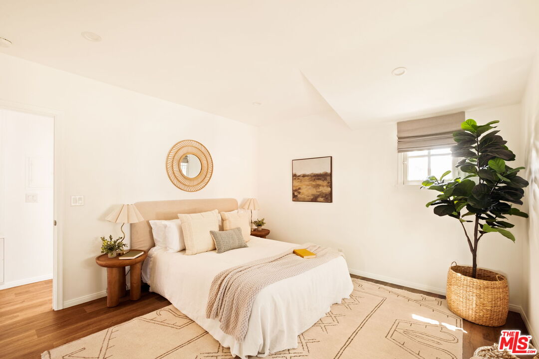 1275 North Craig Avenue Pasadena, CA 91104 - Photo 23 of 30 a bedroom with a bed and a potted plant