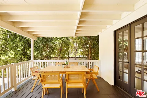 a view of a city from a dining room with large windows