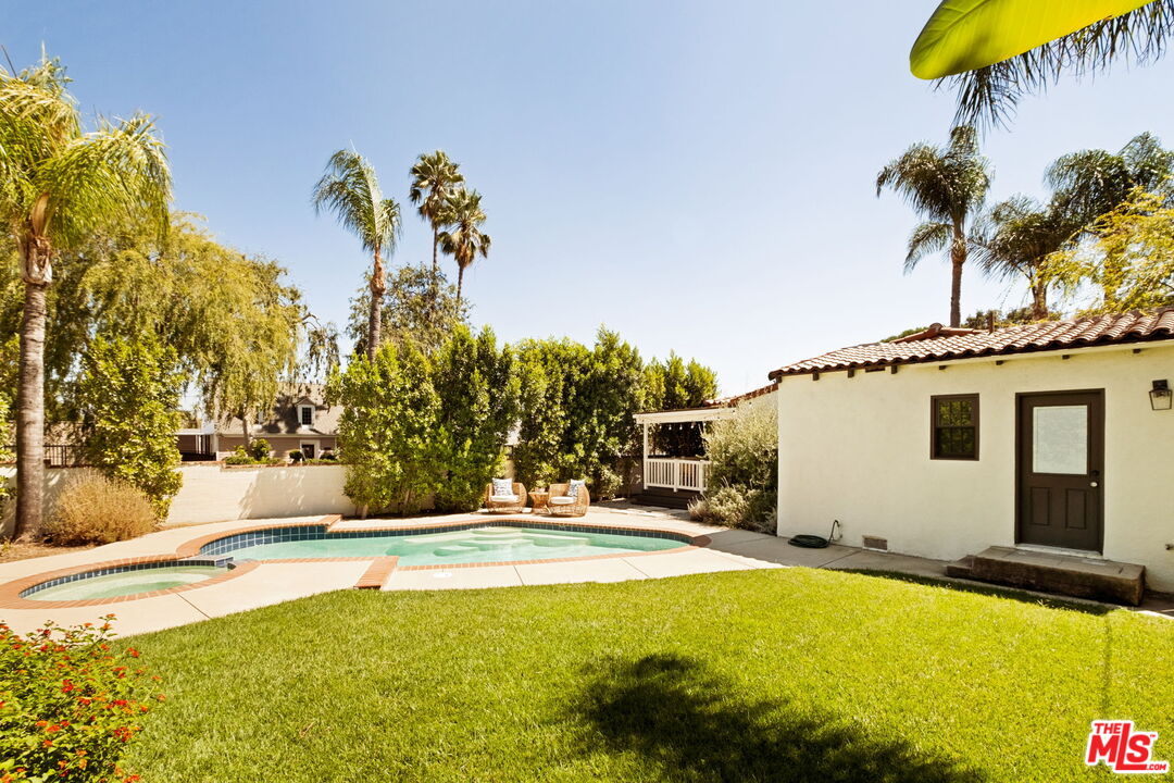 1275 North Craig Avenue Pasadena, CA 91104 - Photo 27 of 30 a swimming pool with yard and outdoor seating