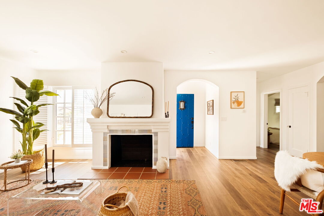 1275 North Craig Avenue Pasadena, CA 91104 - Photo 5 of 30 a living room with furniture a fireplace and a potted plant