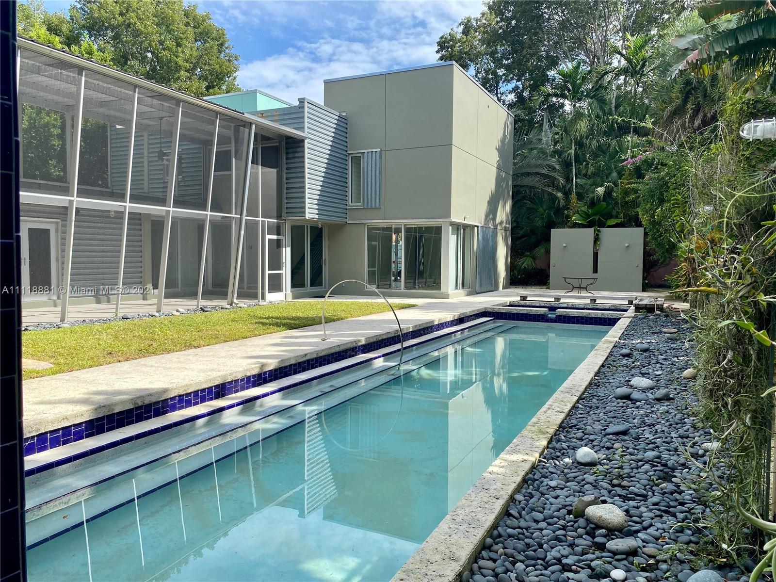 3620 Solana Road Miami, FL 33133 - Photo 20 of 23 a view of a house with a swimming pool