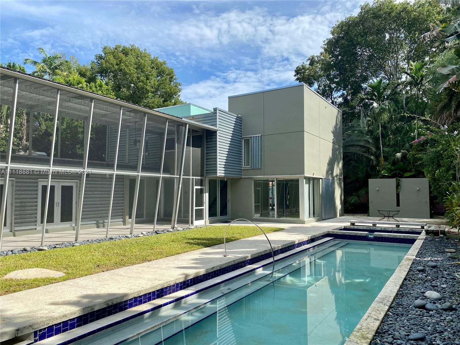 3620 Solana Road Miami, FL 33133 - Photo 21 of 23 a view of a house with backyard and sitting area