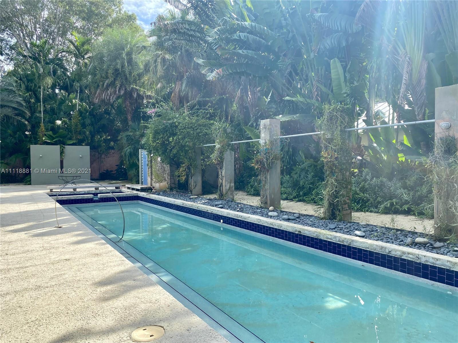 3620 Solana Road Miami, FL 33133 - Photo 22 of 23 a view of a swimming pool with a patio and yard