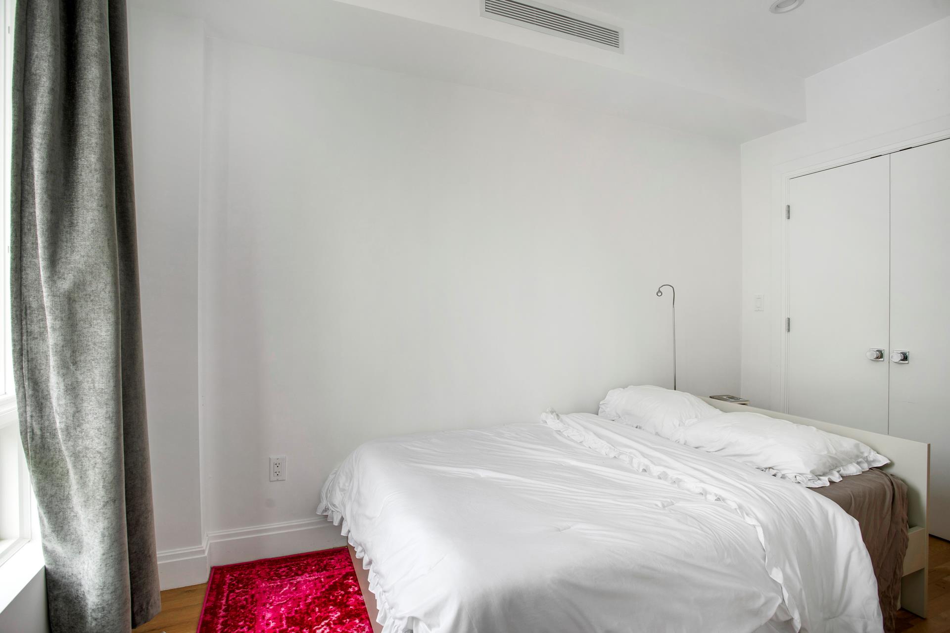 686 MacDonough Street, Unit 3A Brooklyn, NY 11233 - Photo 2 of 7 a bedroom with a bed and a closet