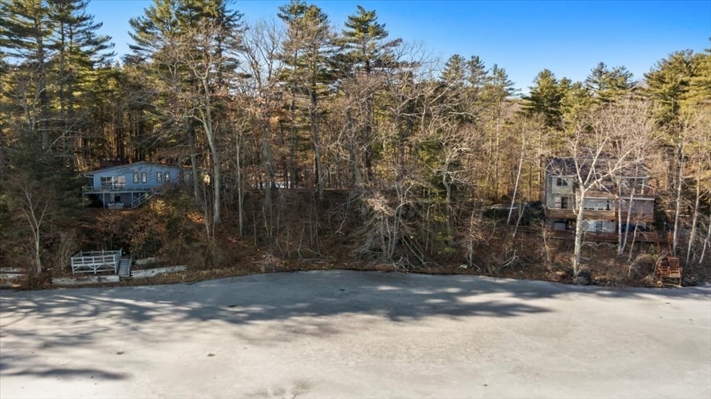 1 Lane 22 Brookfield, MA 01506 - Photo 13 of 24 a view of a barn with wooden fence and large trees