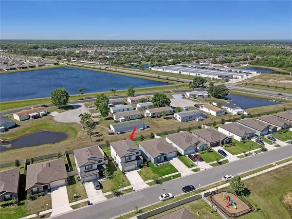 an aerial view of residential houses with outdoor space