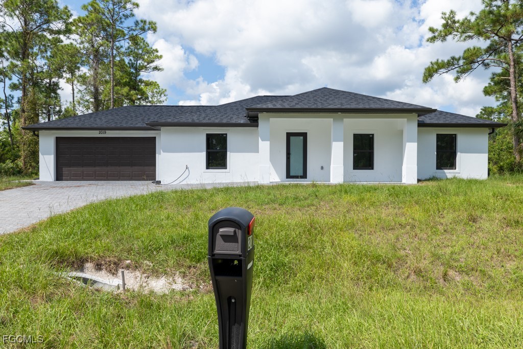 2019 Hamilton Avenue Alva, FL 33920 - Photo 1 of 50 a front view of a house with yard