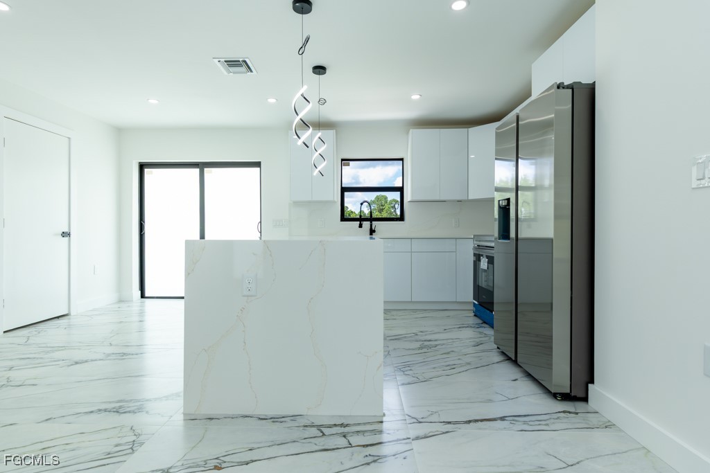2019 Hamilton Avenue Alva, FL 33920 - Photo 11 of 50 a view of a kitchen with a sink and cabinets
