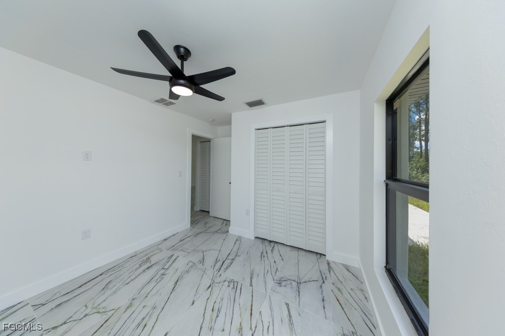 2019 Hamilton Avenue Alva, FL 33920 - Photo 26 of 50 a view of a livingroom with a hardwood floor and a ceiling fan