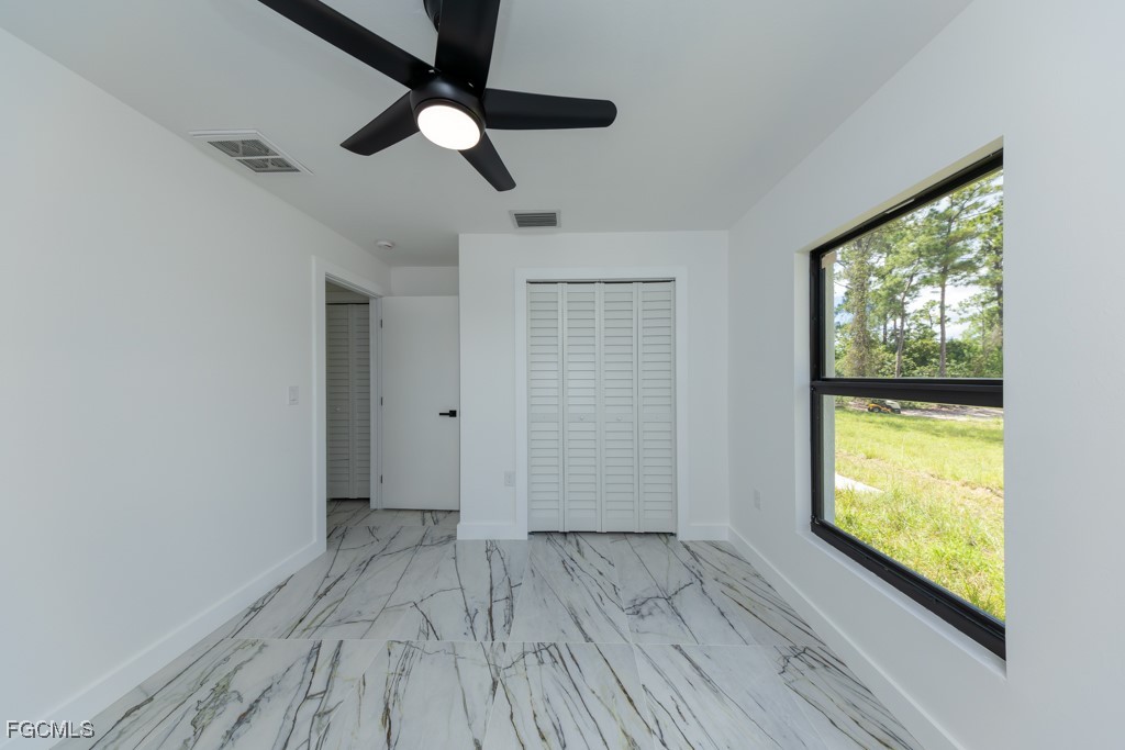 2019 Hamilton Avenue Alva, FL 33920 - Photo 27 of 50 a view of empty room with wooden floor and fan