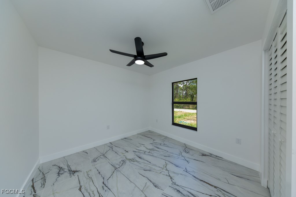 2019 Hamilton Avenue Alva, FL 33920 - Photo 29 of 50 an empty room with window and ceiling fan
