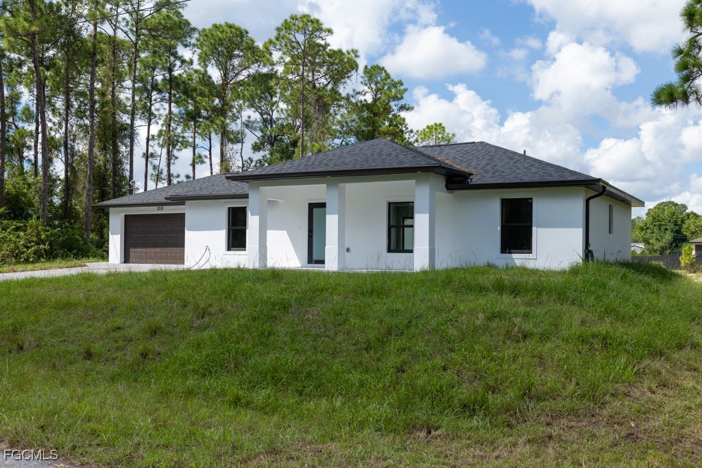 2019 Hamilton Avenue Alva, FL 33920 - Photo 3 of 50 a view of a house with backyard and garden