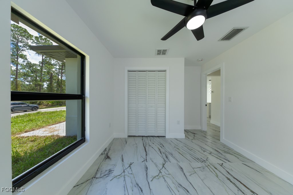 2019 Hamilton Avenue Alva, FL 33920 - Photo 32 of 50 a view of empty room with wooden floor and fan