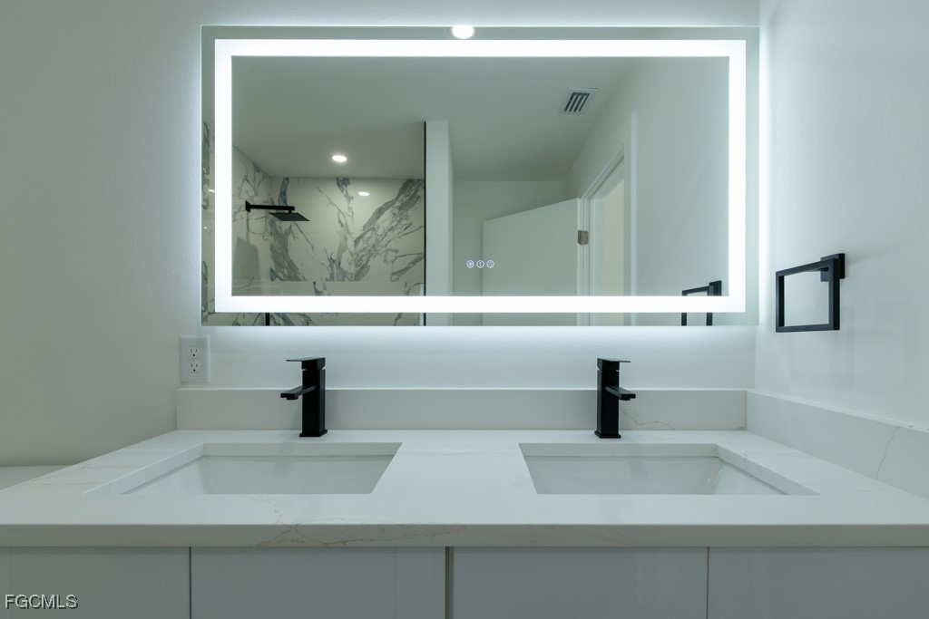 2019 Hamilton Avenue Alva, FL 33920 - Photo 41 of 50 a bathroom with a sink and a mirror