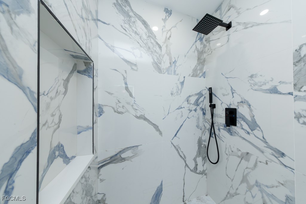 2019 Hamilton Avenue Alva, FL 33920 - Photo 43 of 50 a bathroom with a bathtub and a shower