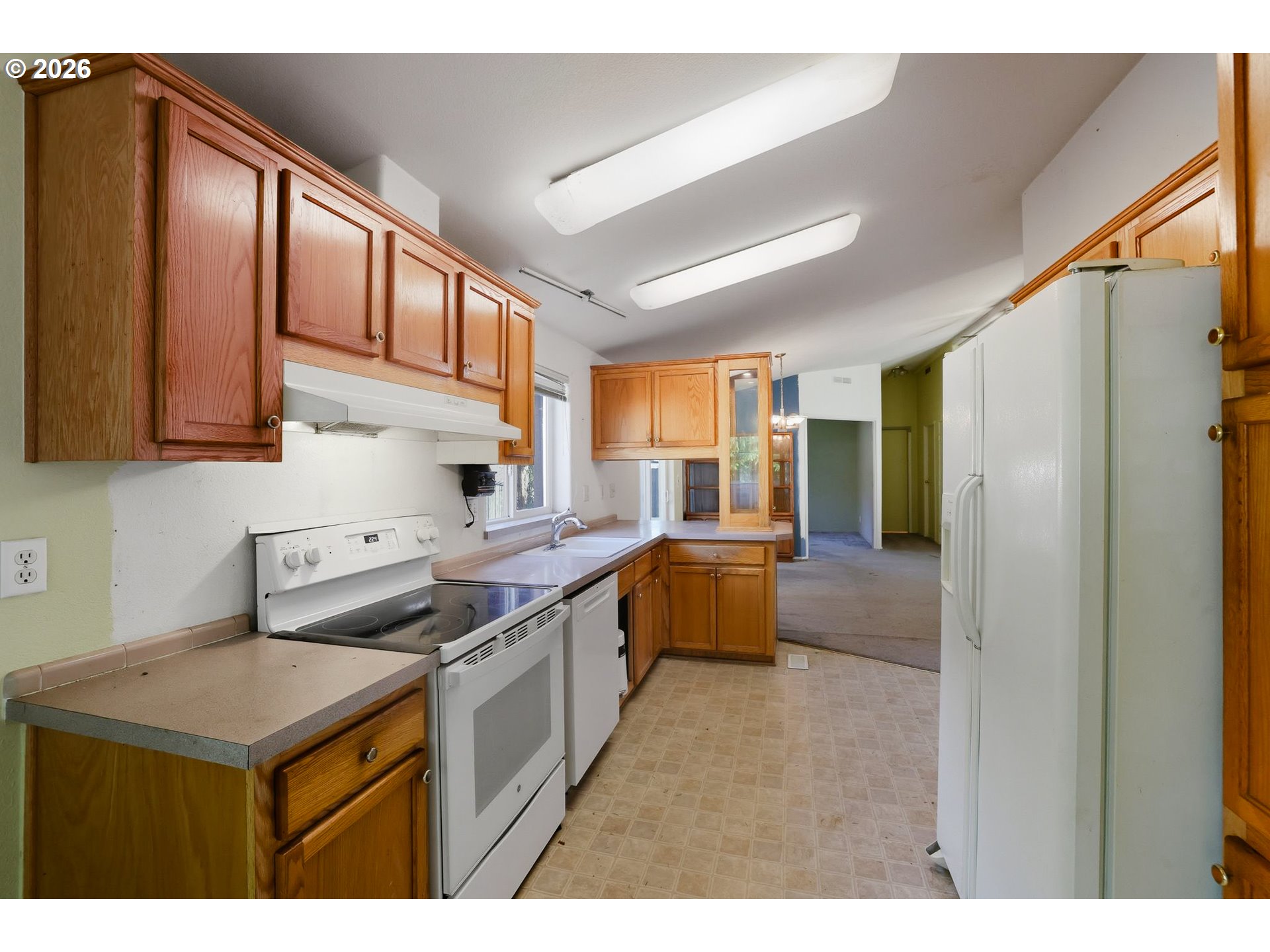 25368 East Cedar Glen Loop Welches, OR 97067 - Photo 12 of 25 a kitchen that has a sink and a stove