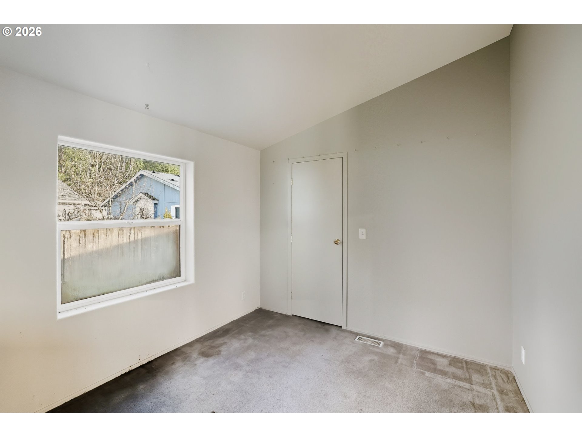 25368 East Cedar Glen Loop Welches, OR 97067 - Photo 16 of 25 a view of an empty room with a window
