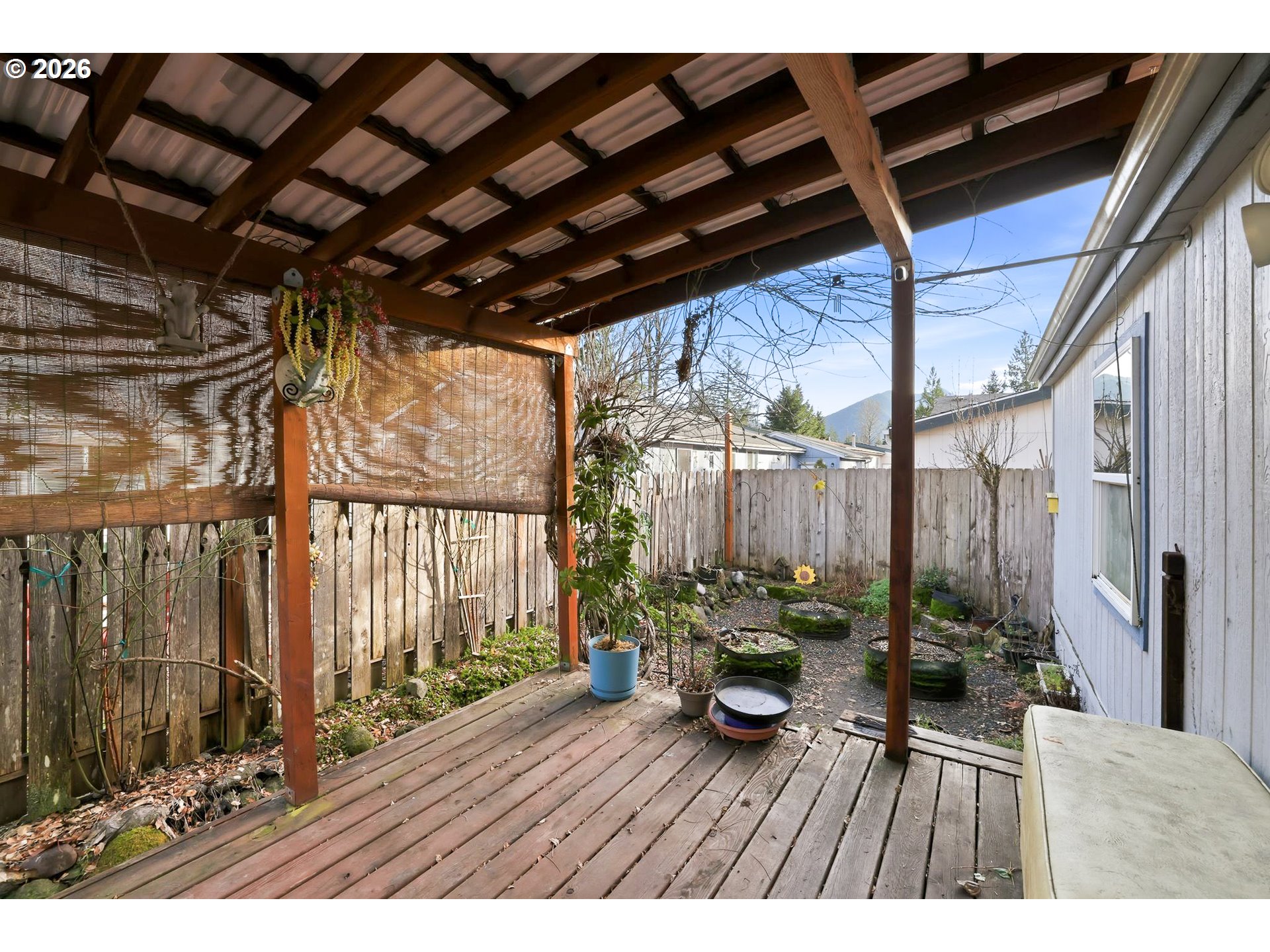 25368 East Cedar Glen Loop Welches, OR 97067 - Photo 23 of 25 a view of a porch with wooden floor