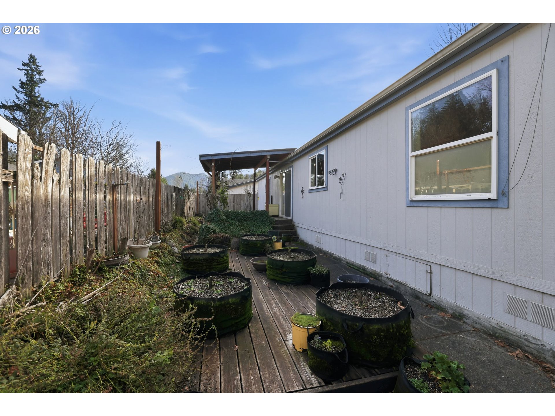 25368 East Cedar Glen Loop Welches, OR 97067 - Photo 25 of 25 a backyard of a house with table and chairs