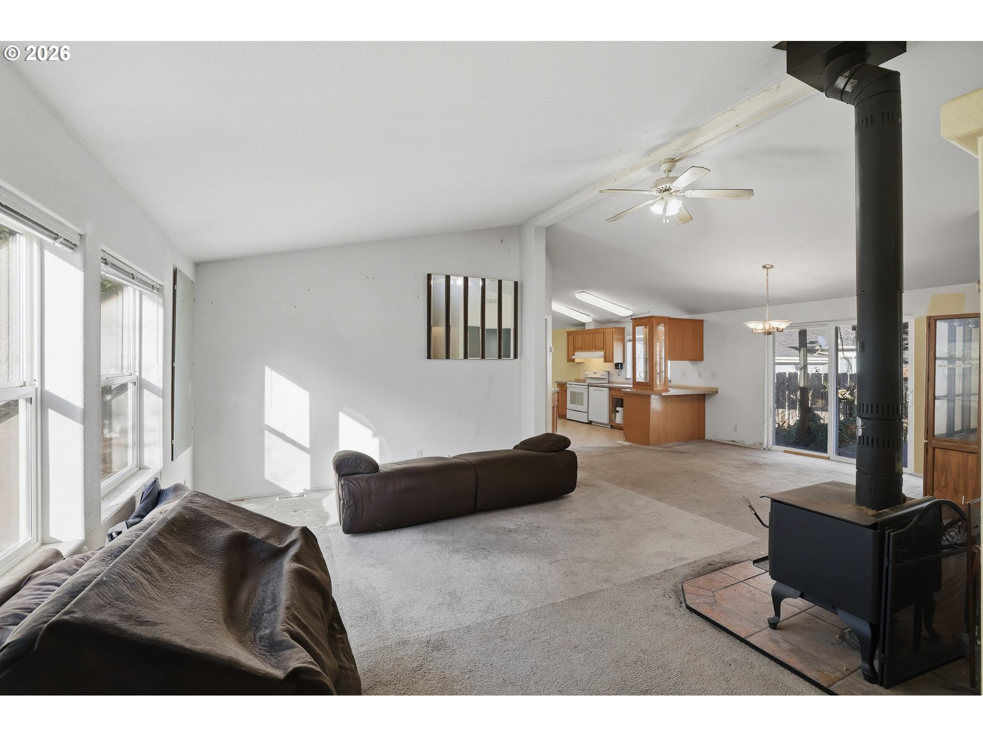 25368 East Cedar Glen Loop Welches, OR 97067 - Photo 5 of 25 a living room with furniture and a large window
