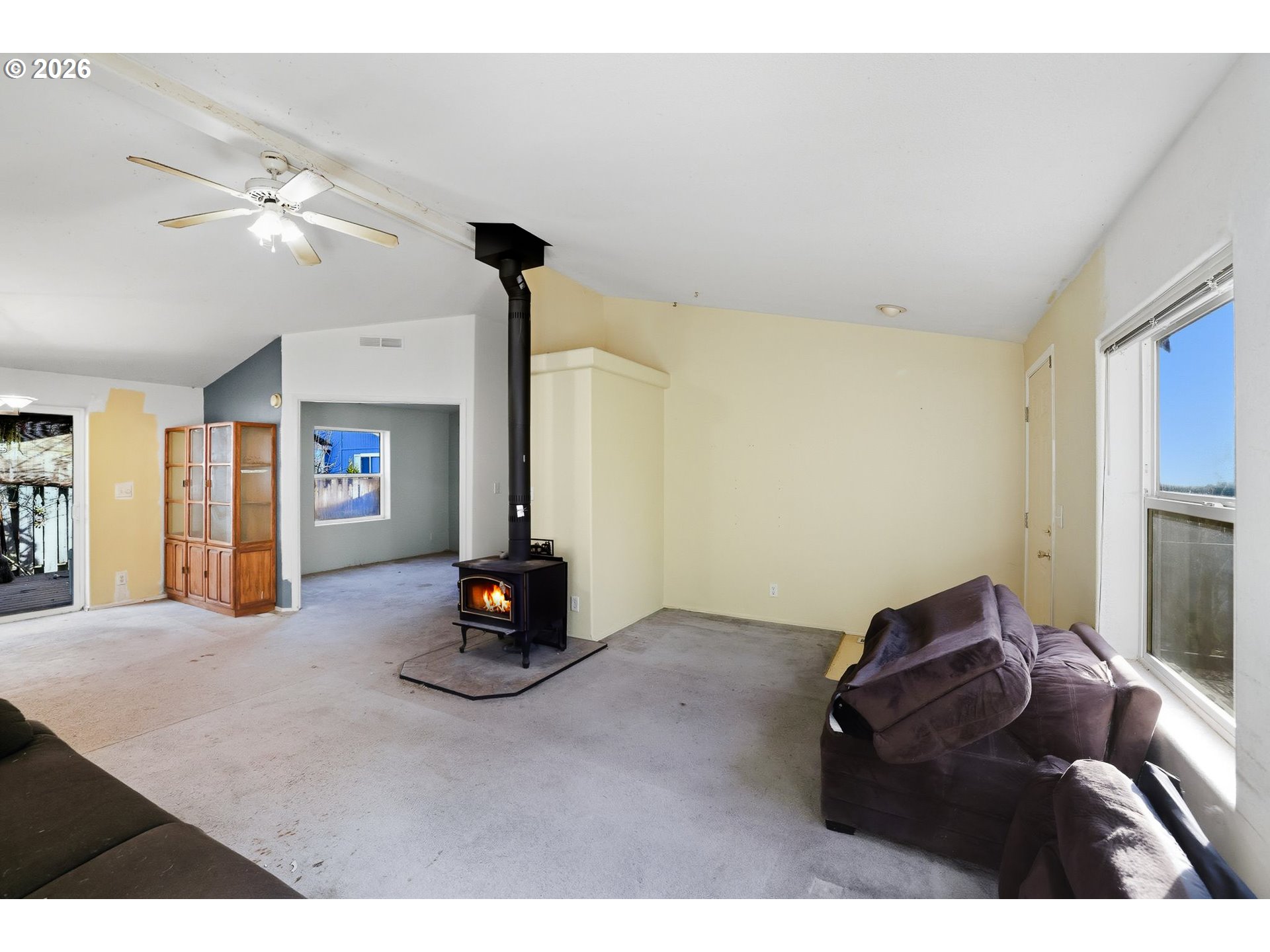 25368 East Cedar Glen Loop Welches, OR 97067 - Photo 6 of 25 a living room with furniture and a flat screen tv