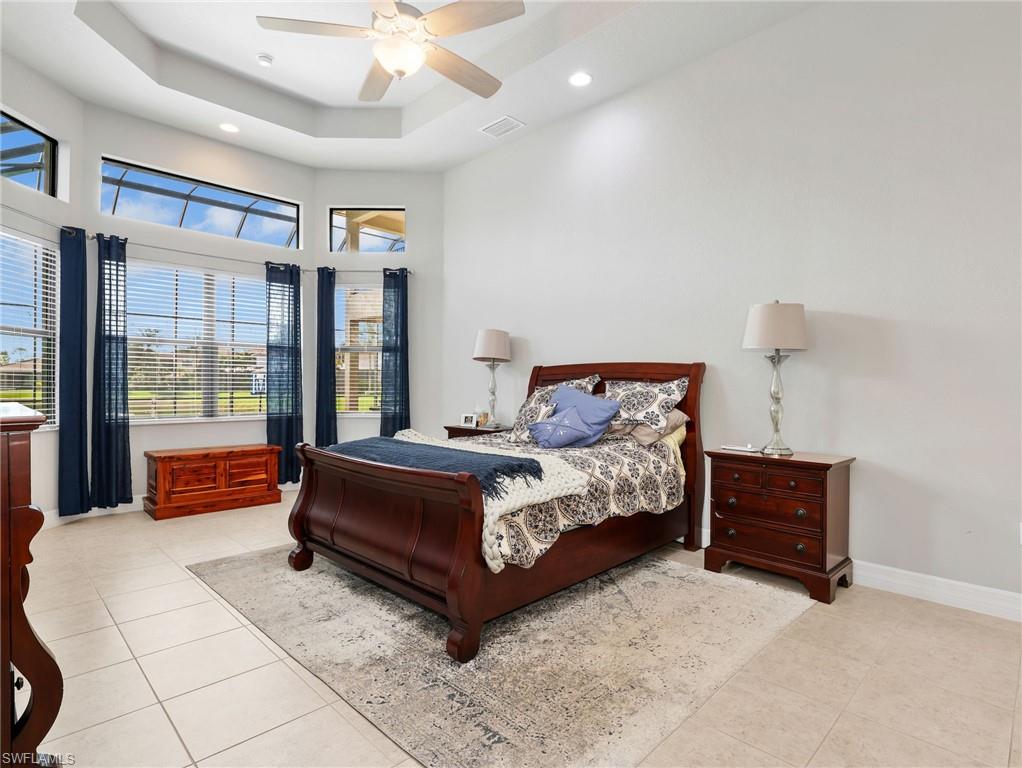 2756 Crystal Way Naples, FL 34119 - Photo 12 of 50 a bedroom with a bed and window
