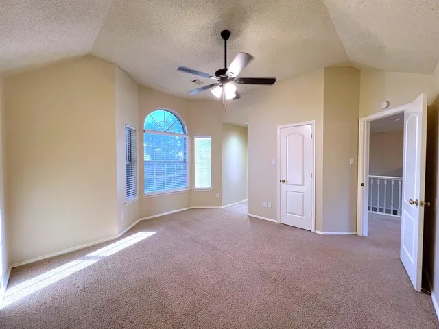 a view of a windows and chandelier fan in a room
