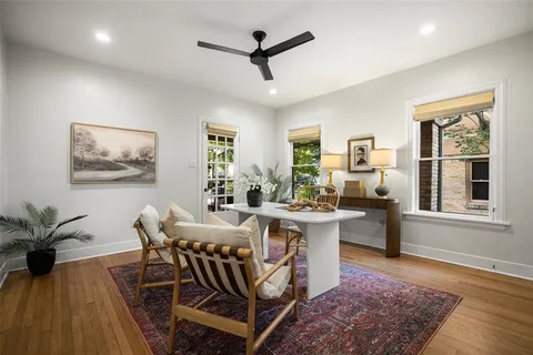 a view of a dining room with furniture window and wooden floor