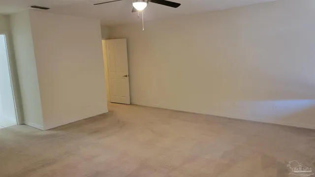 a white bath tub sitting next to a white sink and vanity