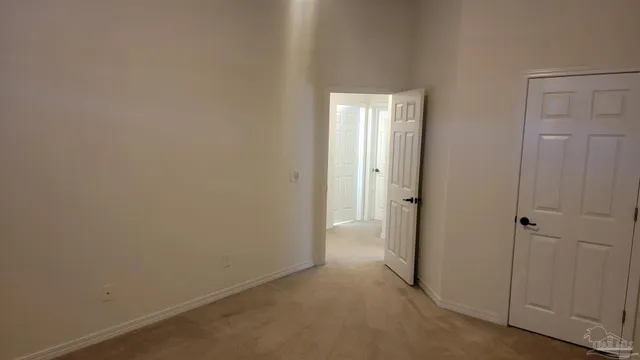 a view of empty room with windows