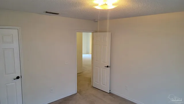 a bathroom with a granite countertop bathtub shower and toilet